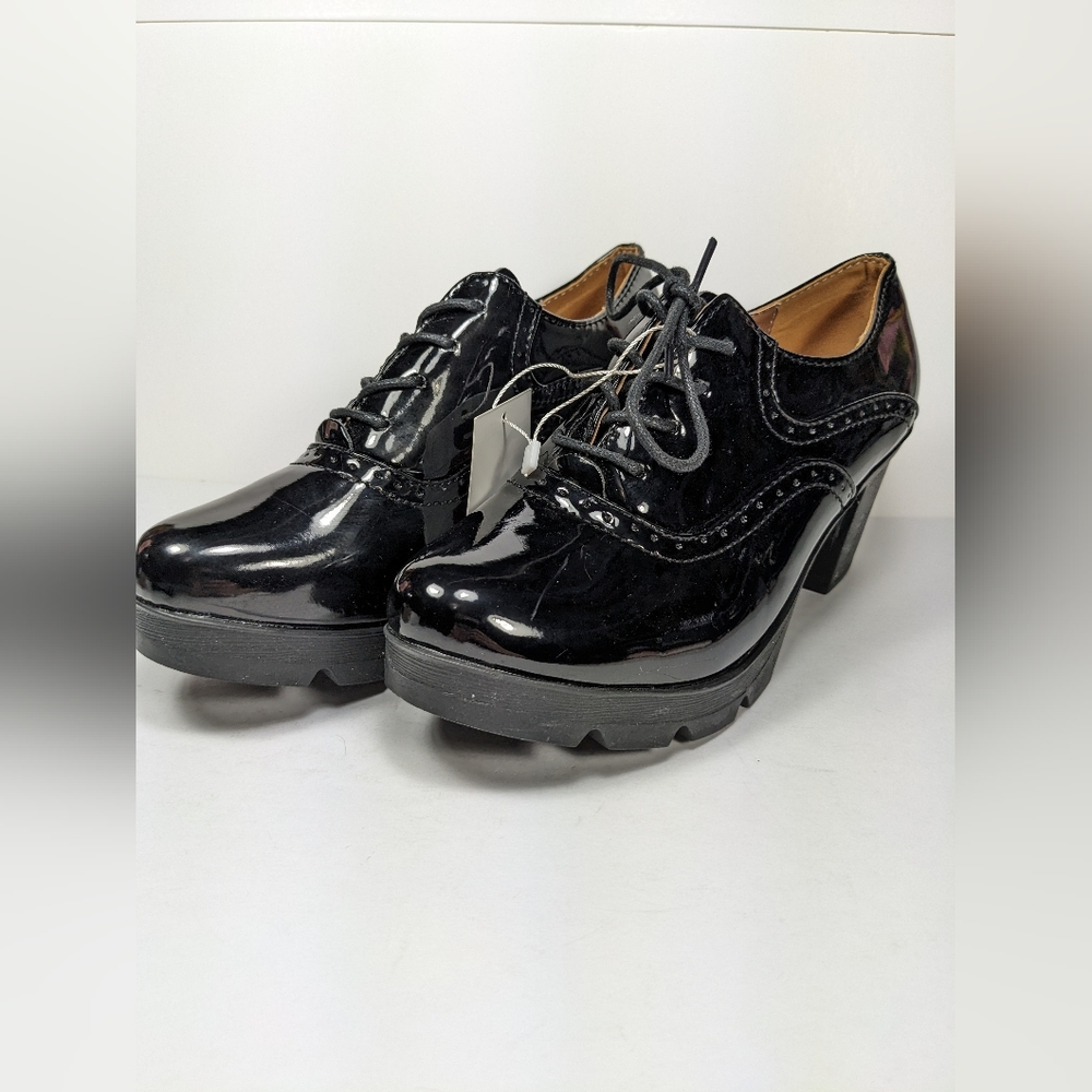 NWT black patent chunky Oxford heels. Never been worn